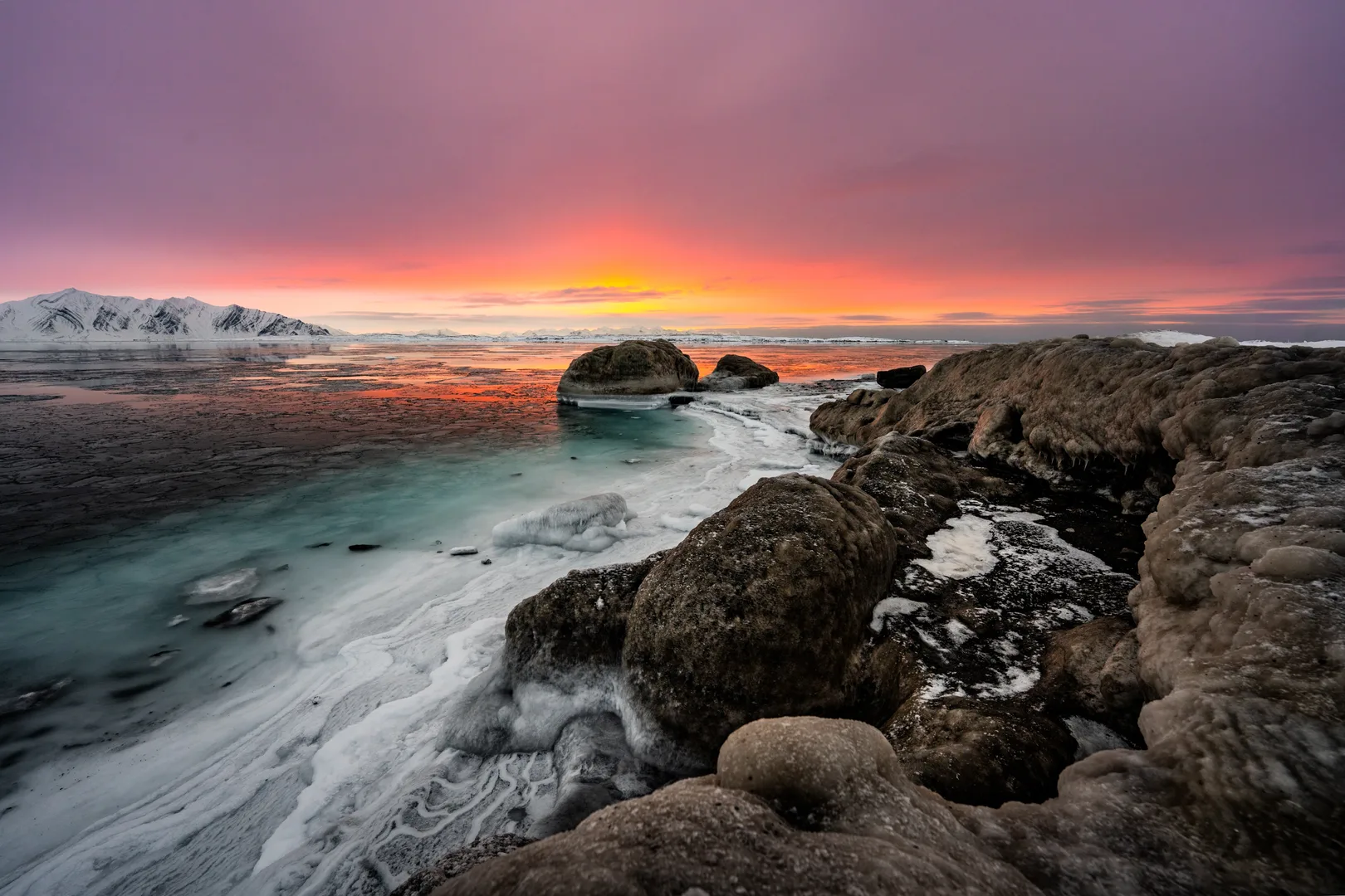 Midnight sun over the rocky coast